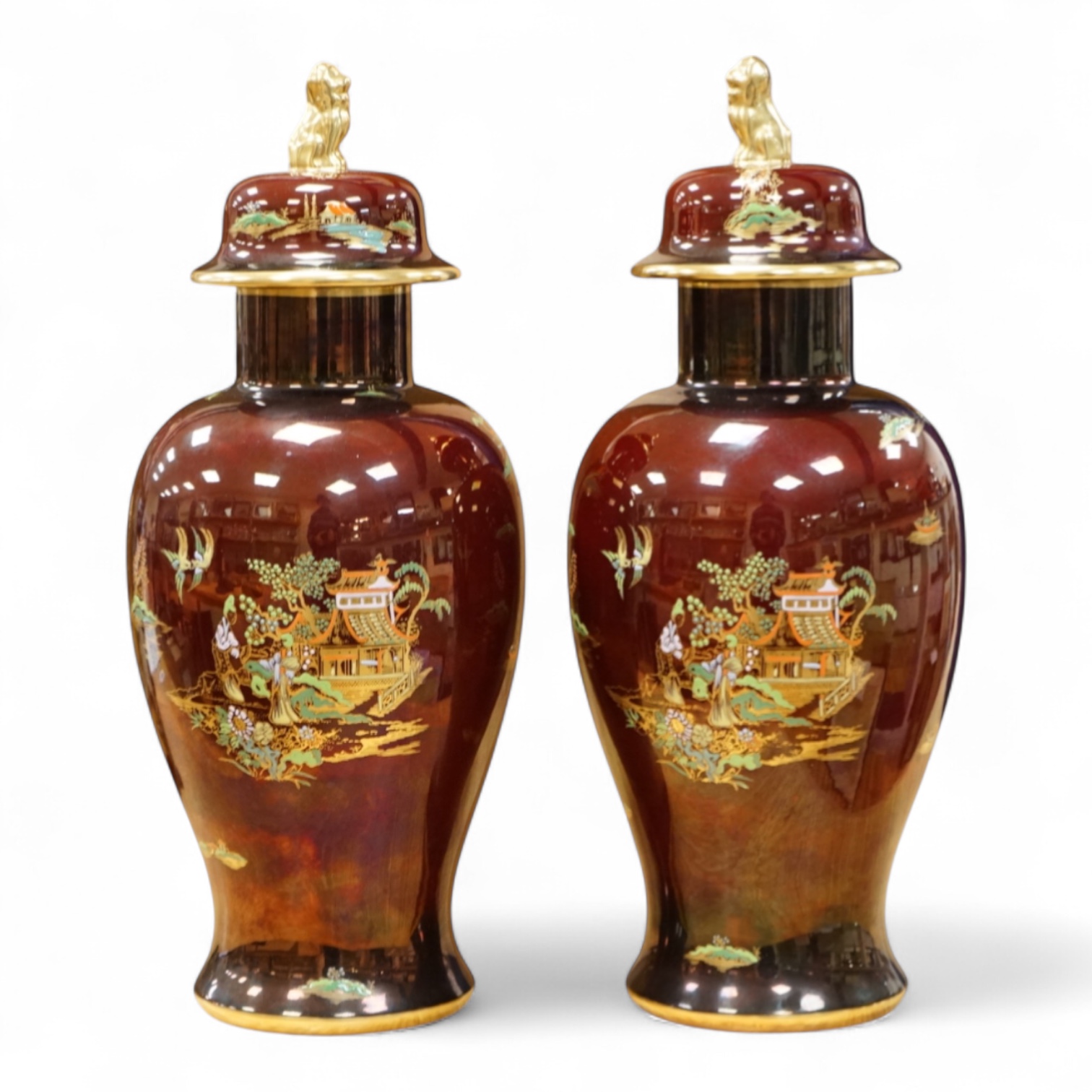 A pair of Carlton Ware Rouge Royale lustre vases and covers with chinoiserie decoration, 38cm high